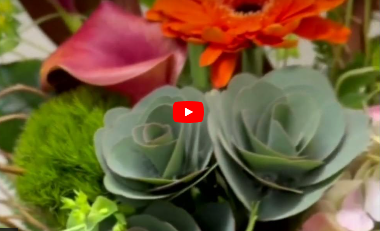 Load video: Amazing colours in this arrangement! Flowers are our specialty.